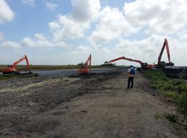 Excavators Placing Wet Material for the Drying Out process